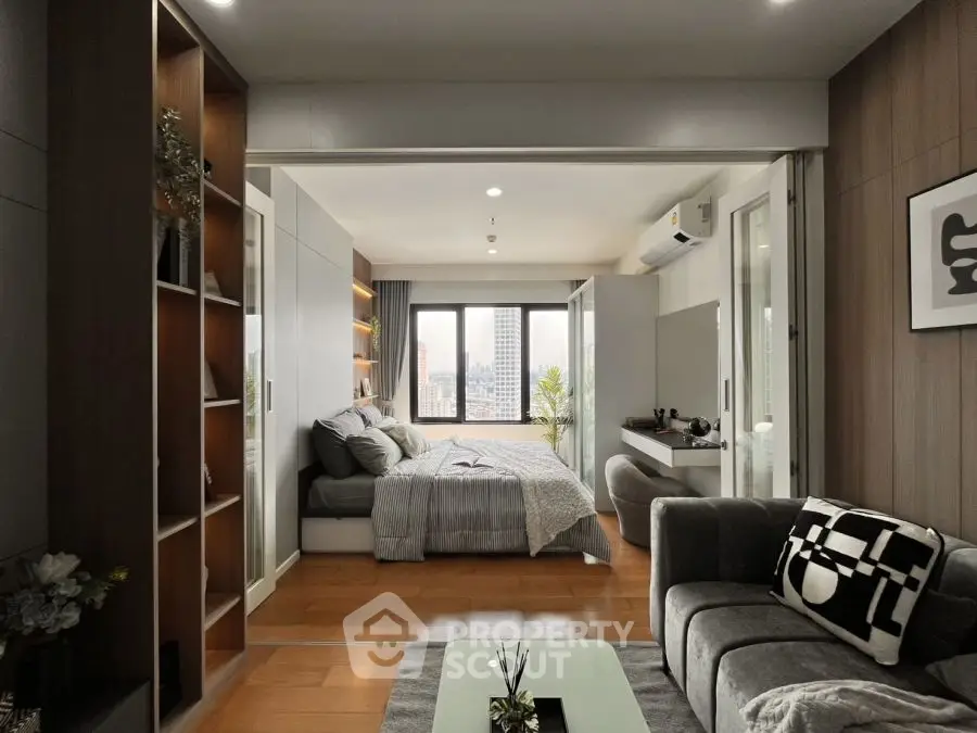 Modern open-plan living room and bedroom with city view, stylish decor, and cozy ambiance.