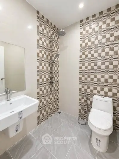 Modern bathroom with stylish tile design and sleek fixtures