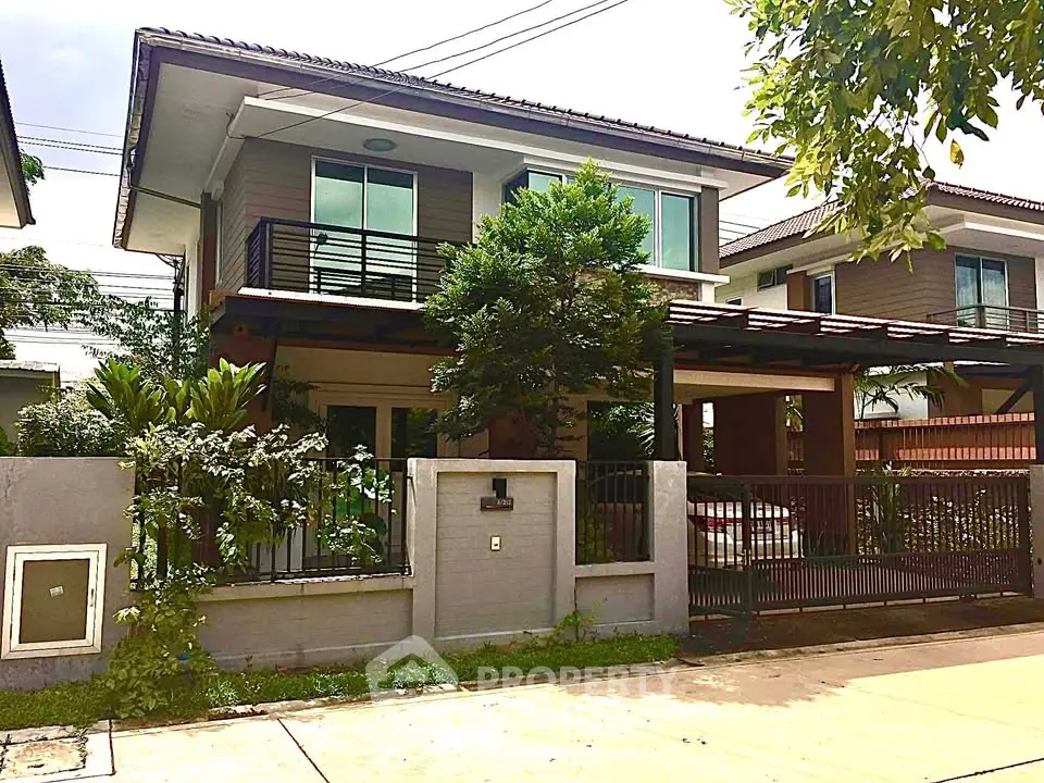 Charming two-story house with lush garden and modern design in a serene neighborhood.