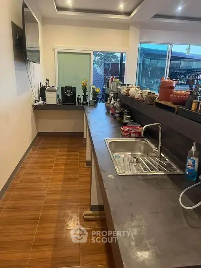 Modern kitchen with sleek countertops and ample storage space