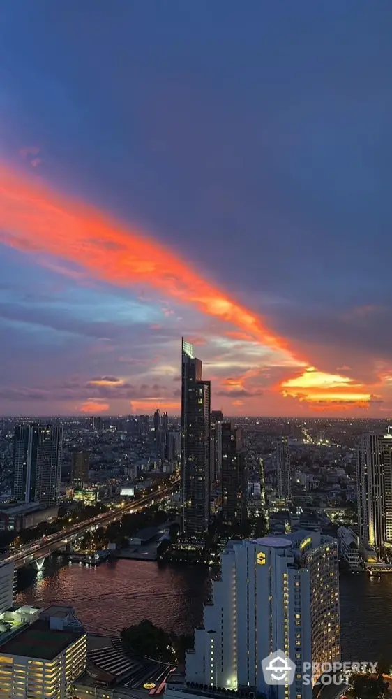 Stunning cityscape view with vibrant sunset over modern skyline and river.