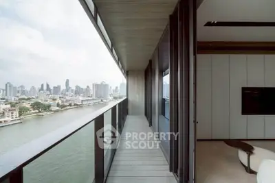 Stunning high-rise balcony with panoramic city and river views, perfect for urban living.