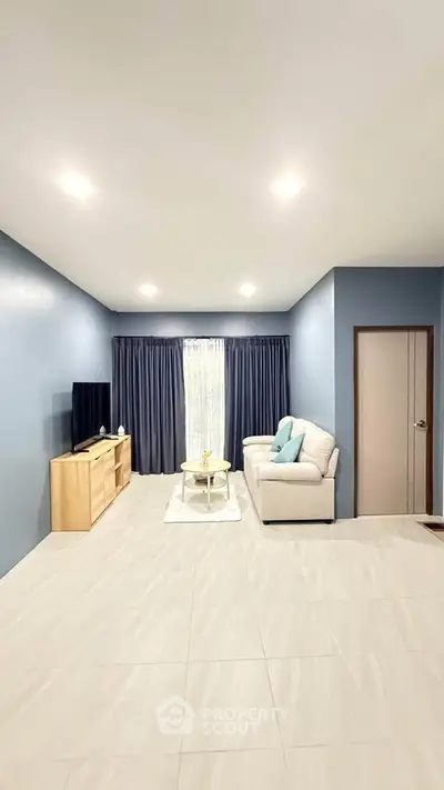 Spacious modern living room with elegant decor and natural light