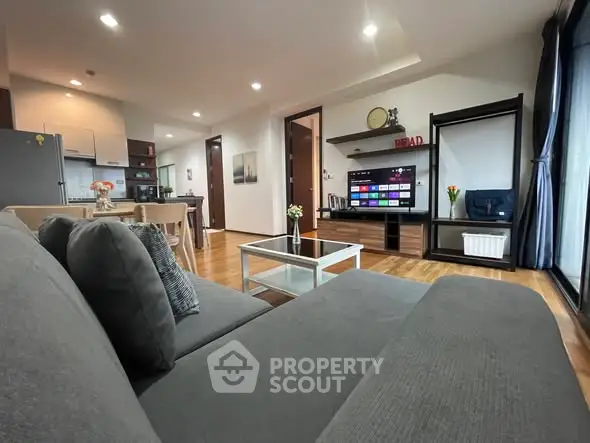 Spacious modern living room with open kitchen and stylish decor