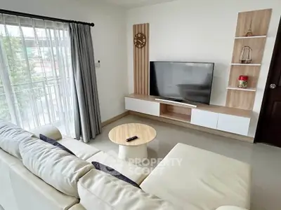 Modern living room with sleek TV setup and stylish decor