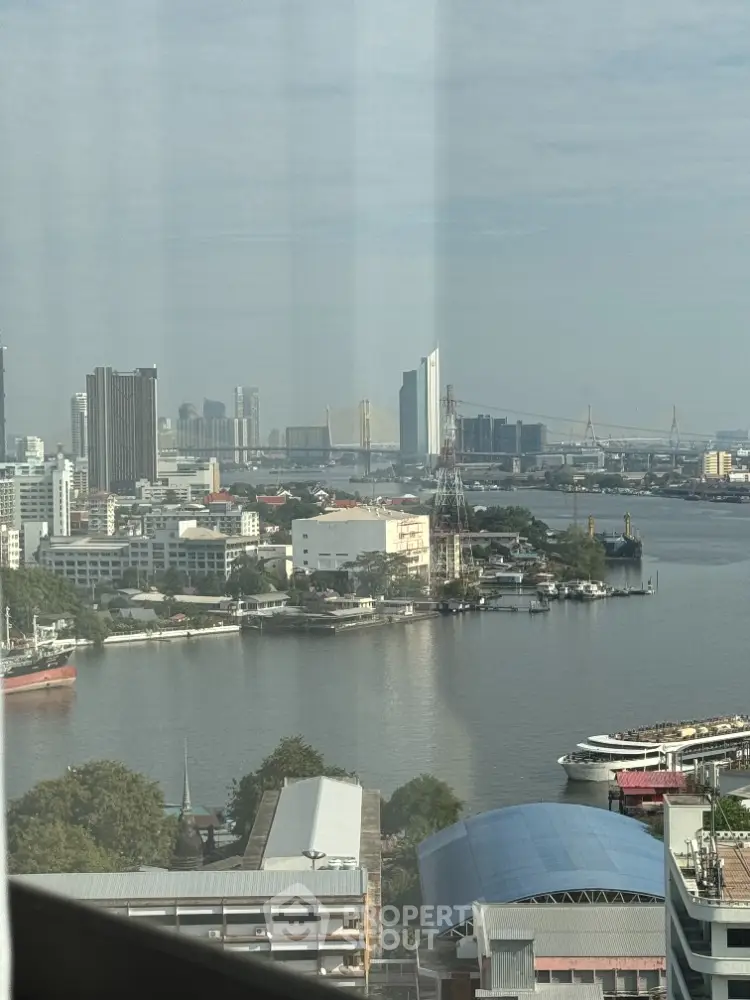 Stunning high-rise view of city skyline and river, perfect for urban living enthusiasts.