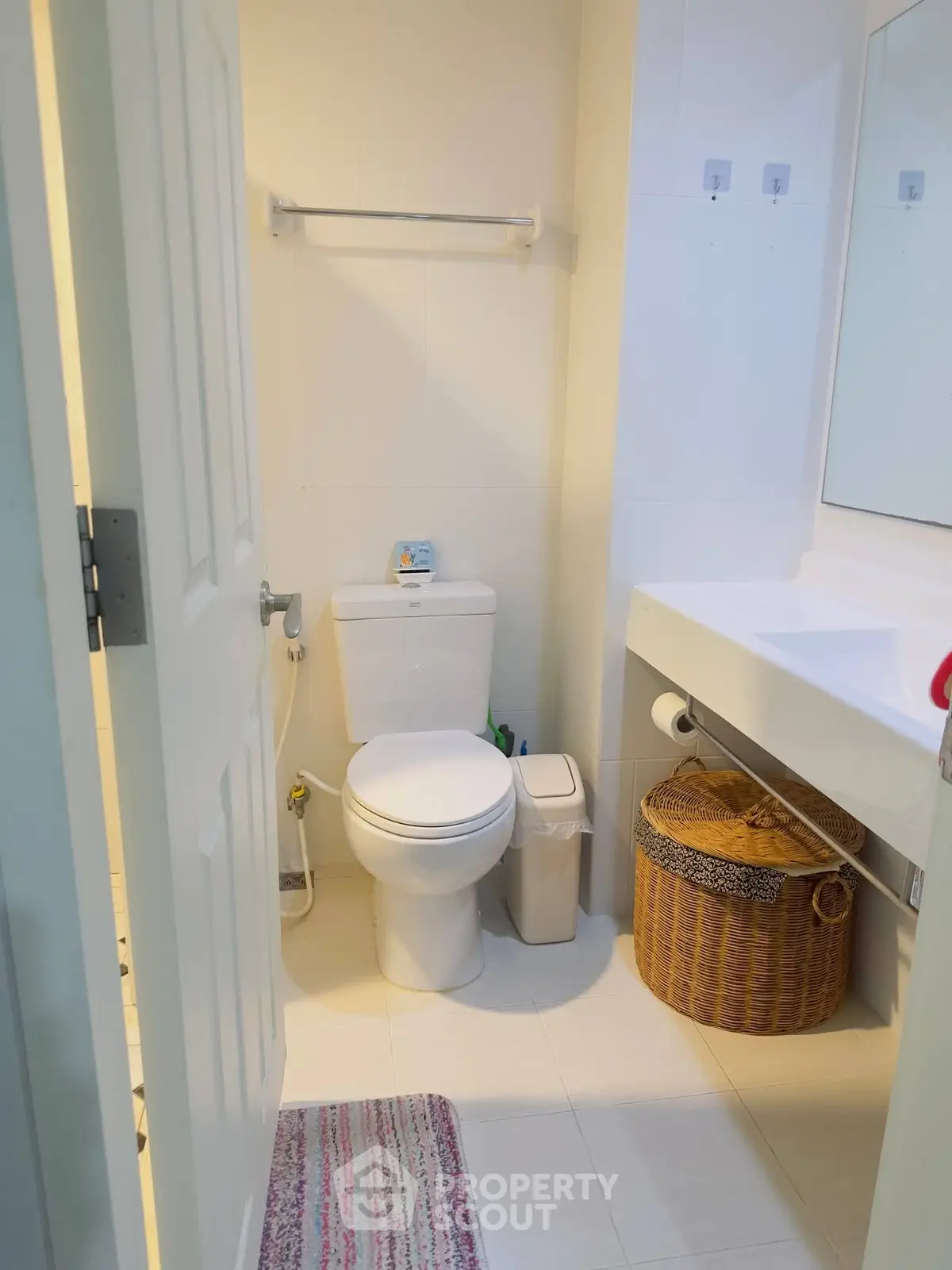 Modern bathroom with sleek fixtures and ample storage space.