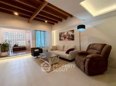 Spacious living room with modern decor and cozy seating area