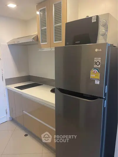 Modern kitchen with sleek appliances and ample storage space
