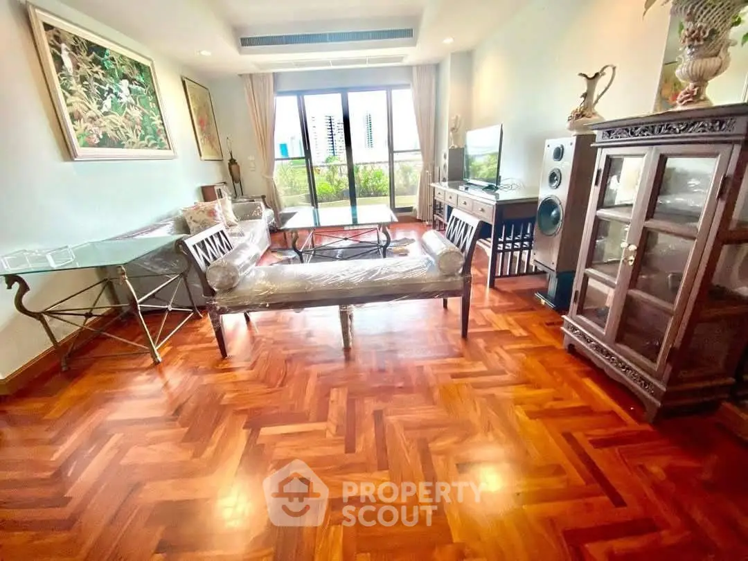 Spacious living room with elegant wooden flooring and modern decor