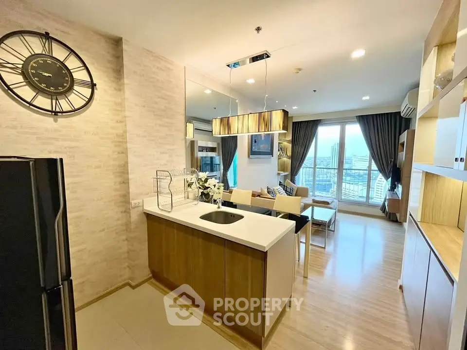 Modern open-layout kitchen and living room with city view in stylish apartment