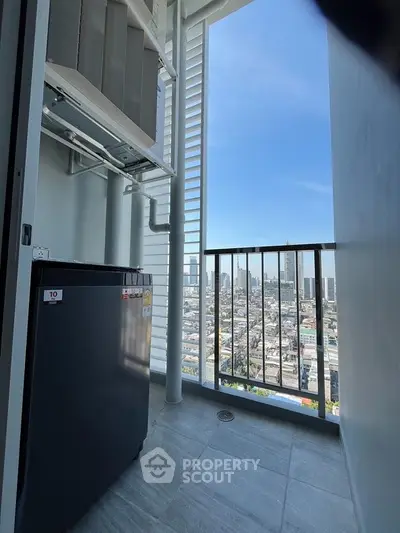 Modern balcony with city view and compact outdoor storage area.