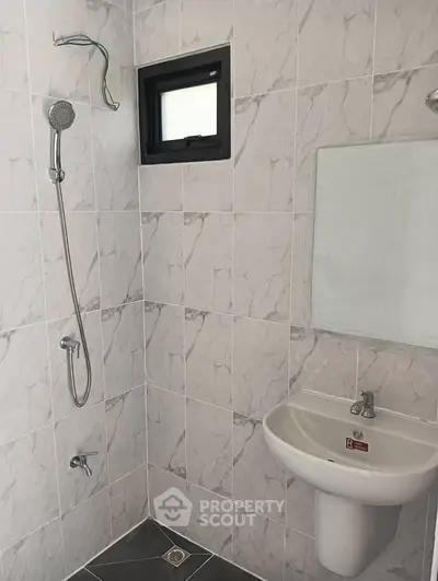 Modern bathroom with sleek tiles and minimalist fixtures