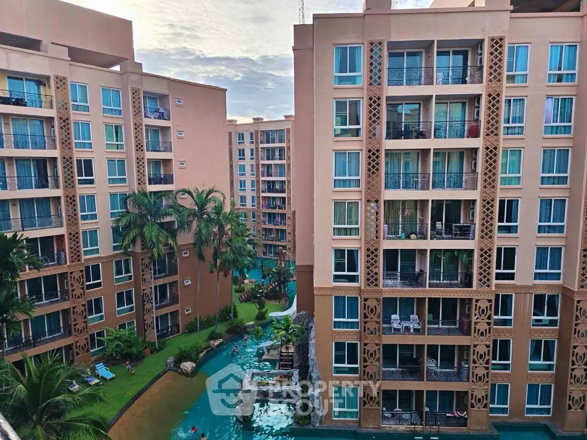 Luxurious apartment complex with pool and lush landscaping