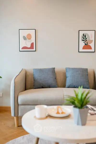 Stylish living room with modern sofa and decor, perfect for cozy relaxation.