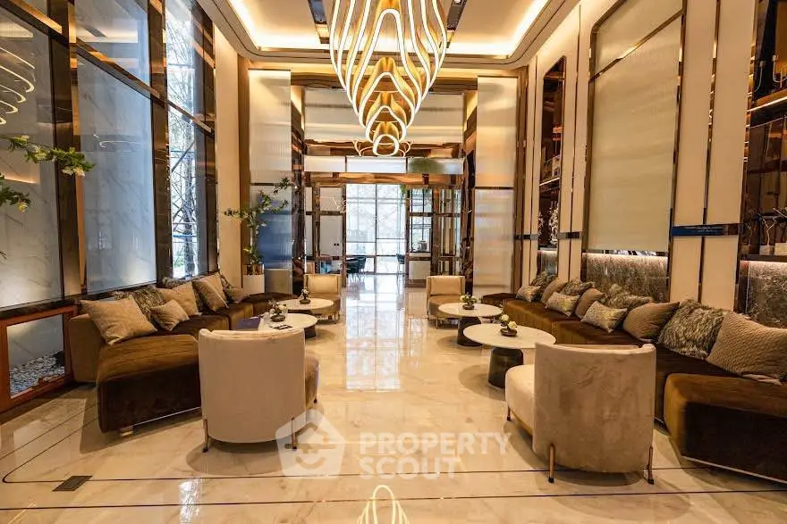 Luxurious lobby with elegant seating and modern lighting in upscale building