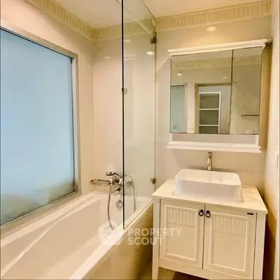 Elegant bathroom with modern fixtures and a spacious bathtub