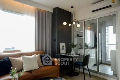 Modern living room with stylish decor and open kitchen layout