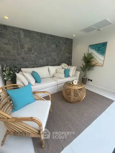 Stylish living room with stone accent wall and modern furniture