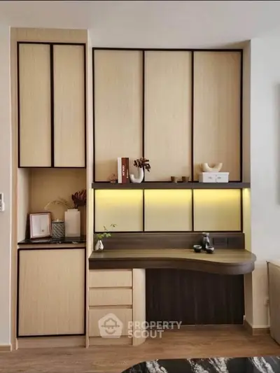 Modern study area with sleek wooden cabinetry and ambient lighting