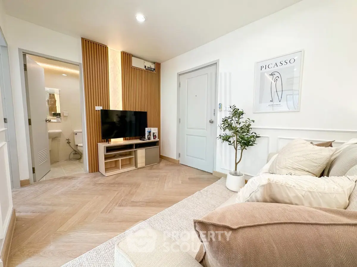 Modern living room with stylish decor and open bathroom view