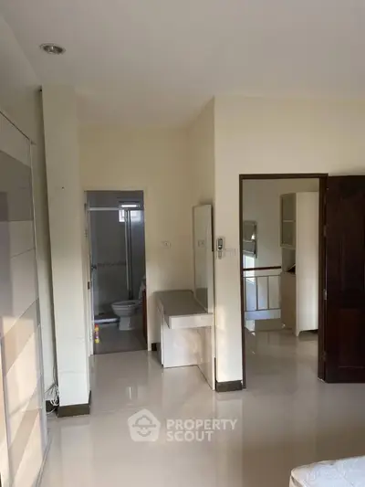 Spacious bedroom with ensuite bathroom and modern design