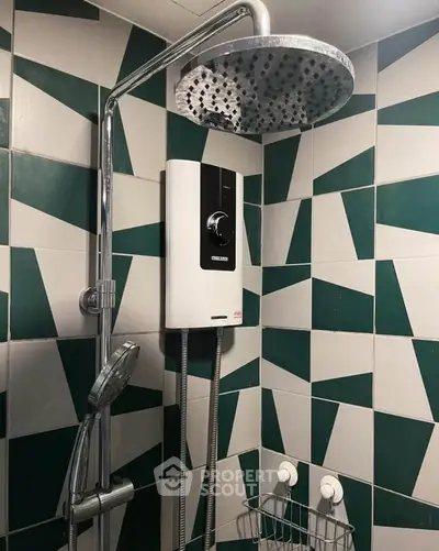 Modern bathroom with stylish geometric tiles and a sleek shower system.