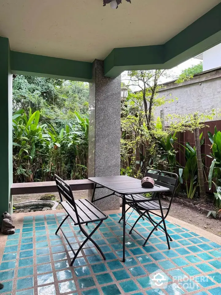 Charming garden patio with stylish outdoor furniture and lush greenery