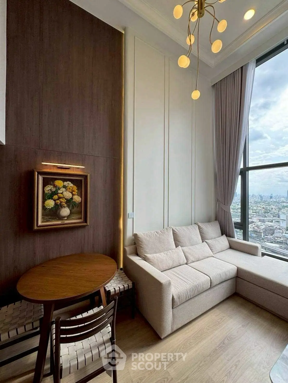 Stylish living room with city view, modern lighting, and cozy seating area.