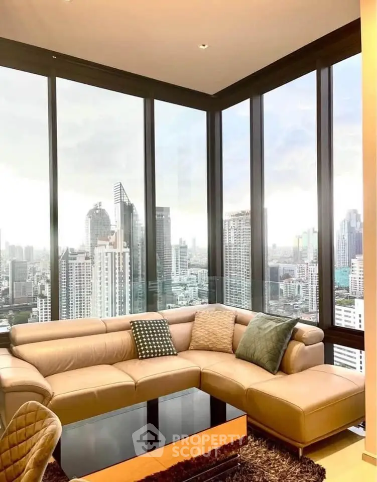 Luxurious corner unit living room with panoramic city views and elegant furnishings.