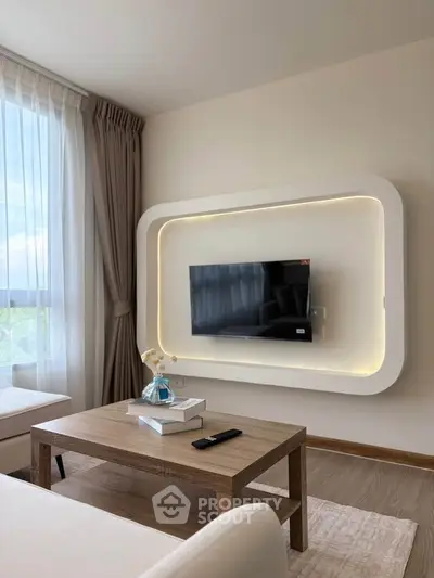 Modern living room with stylish TV wall mount and cozy seating area