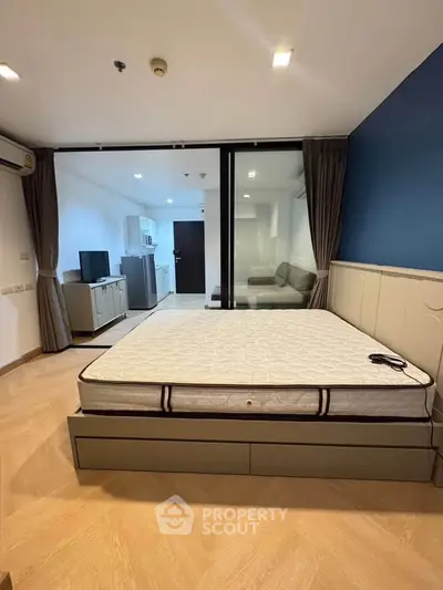 Modern bedroom with glass partition, showcasing a spacious layout and stylish design.