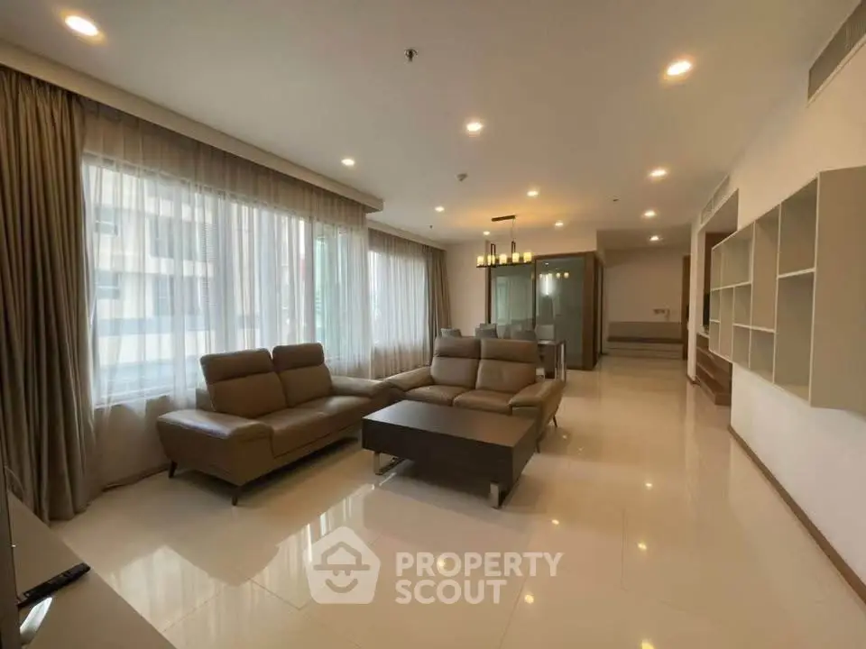 Spacious modern living room with elegant furniture and large windows