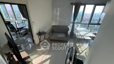 Modern high-rise apartment with stunning city view and stylish interior design.