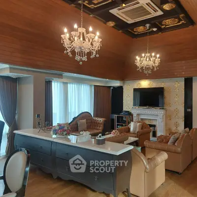 Luxurious living room with elegant chandeliers and classic leather furniture