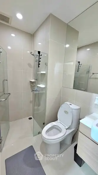 Modern bathroom with glass shower and sleek fixtures