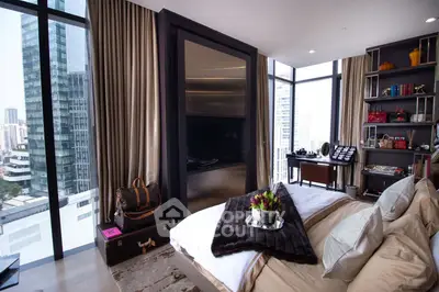 Luxurious bedroom with stunning city view and elegant decor in high-rise apartment.