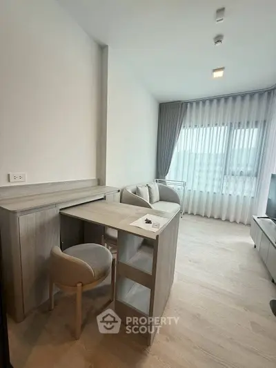 Modern living room with stylish furniture and natural light