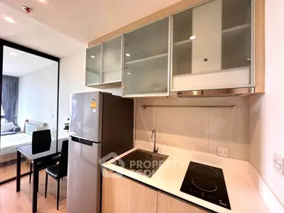 Modern kitchen with sleek appliances and open layout in stylish apartment