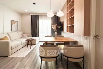Modern living room with elegant decor and cozy seating area, perfect for relaxation.
