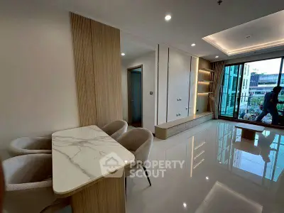 Modern living room with elegant dining area and large windows