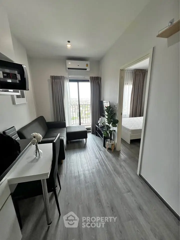 Modern apartment living room with sleek furniture and natural light