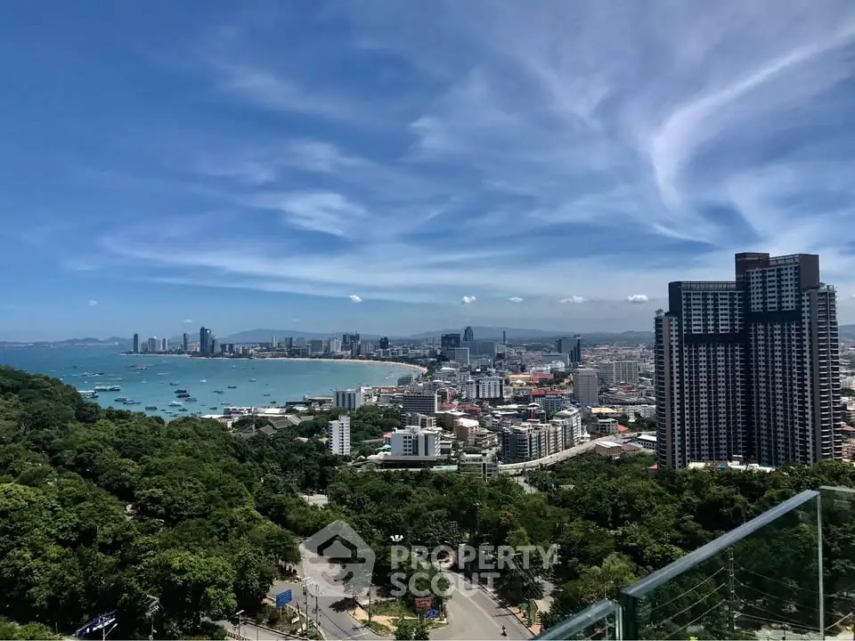 Stunning cityscape view with ocean and skyline from high-rise balcony