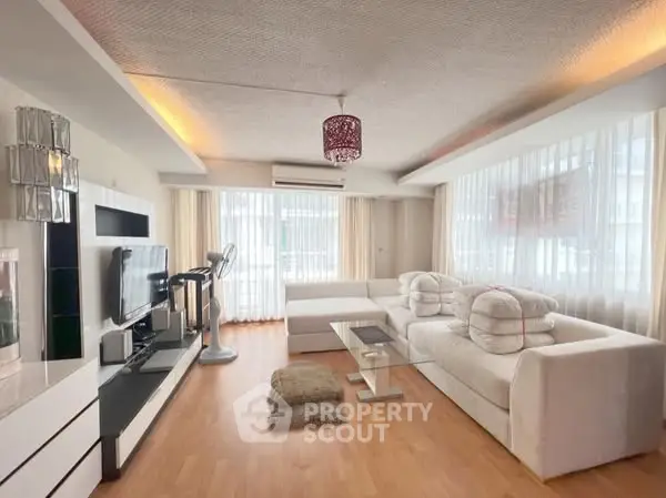 Spacious modern living room with elegant decor and natural light