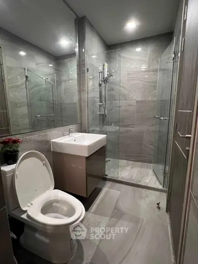 Modern bathroom with sleek glass shower and contemporary fixtures