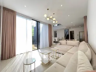 Luxurious modern living room with elegant decor and ample natural light