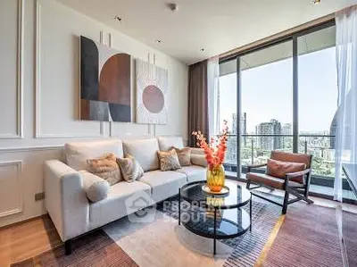 Modern living room with stylish decor and large windows offering city views.