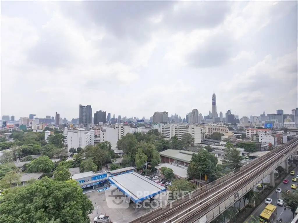 Stunning cityscape view showcasing urban skyline and lush greenery, ideal for real estate investment.