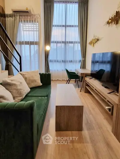 Luxurious high-ceiling living room with modern decor and large windows offering stunning city views.