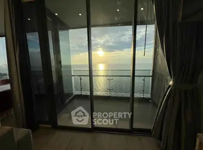 Stunning ocean view from modern balcony at sunset